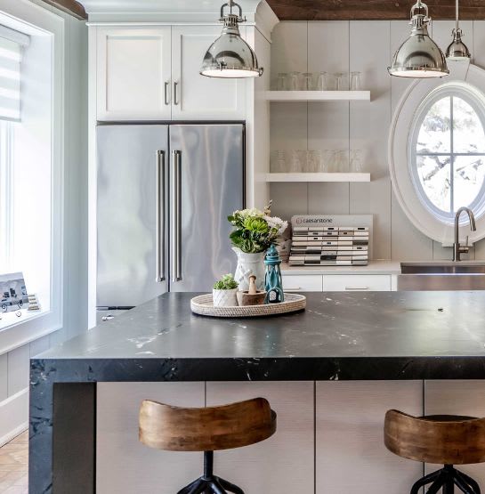 Charming white kitchen with elegant and natural black Quartzite kitchen countertop