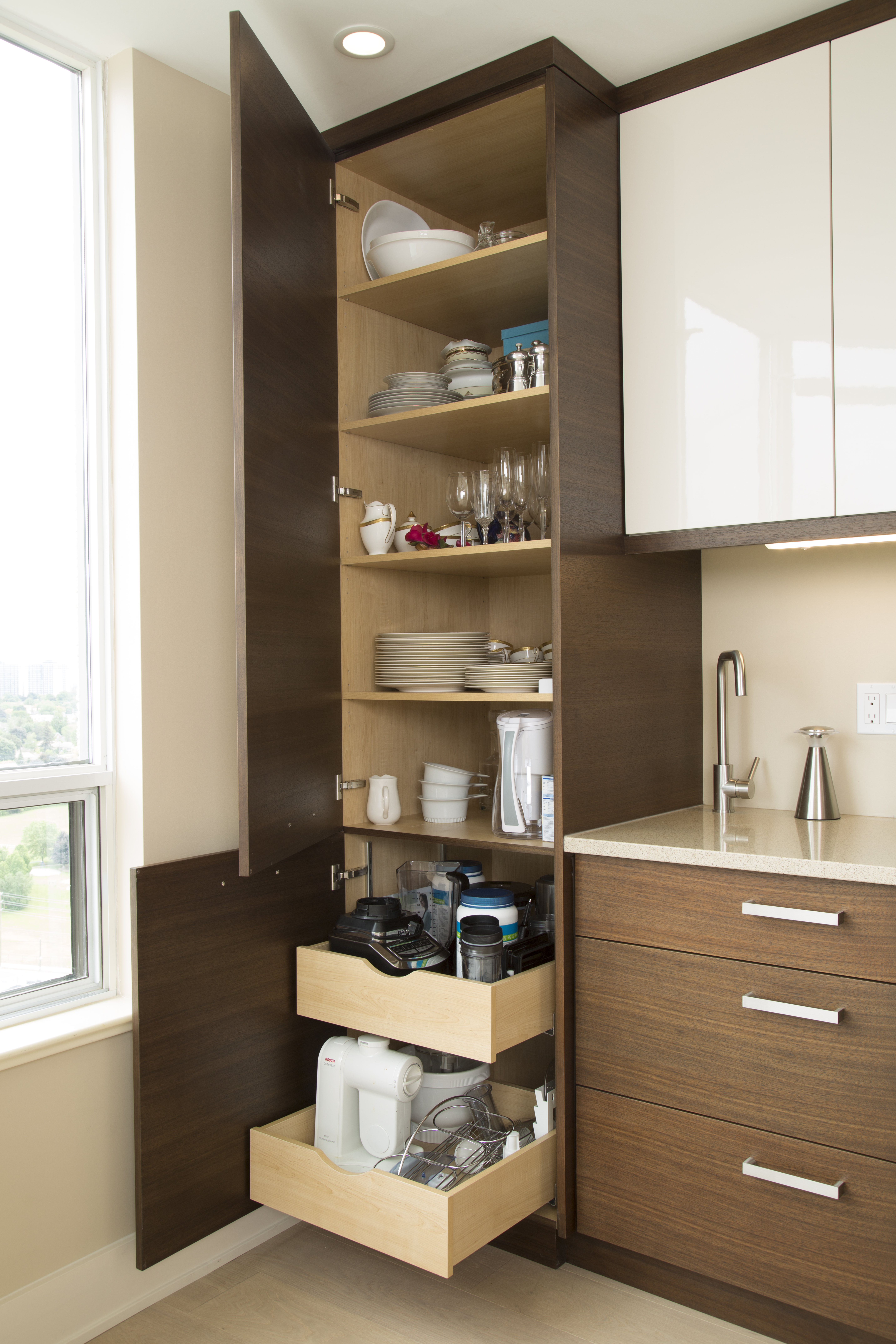 Modern white and wood coffee station pantry cabinet with roll-outs and shelving