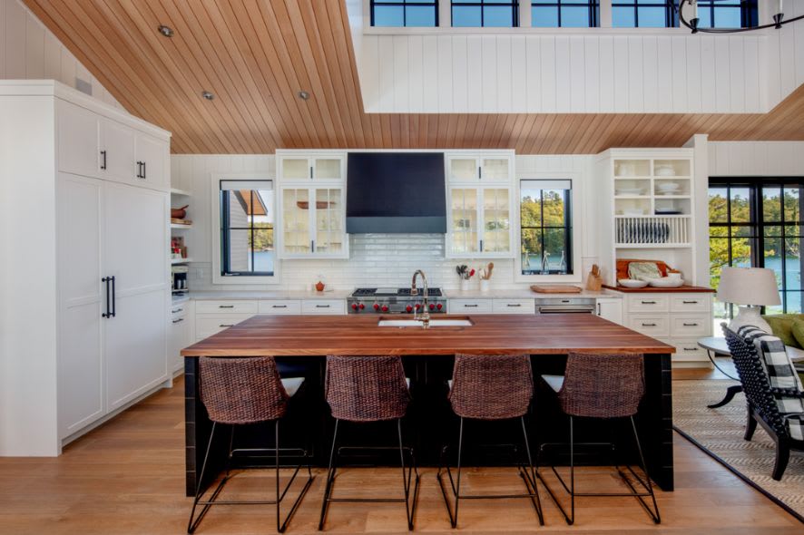 white farmhouse cottage kitchen with live wood top island