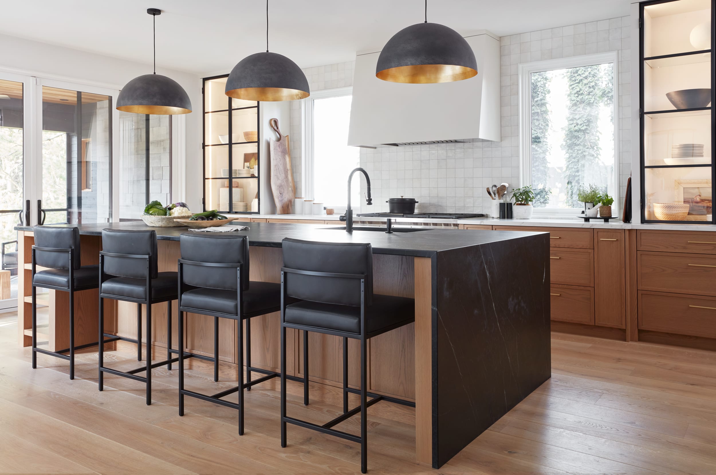 A custom kitchen with stained white oak and painted white cabinetry.