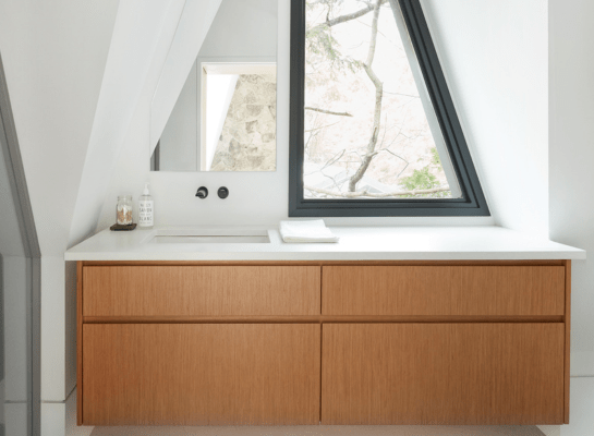 Close up of live-edge wooden kitchen countertop in rustic kitchen