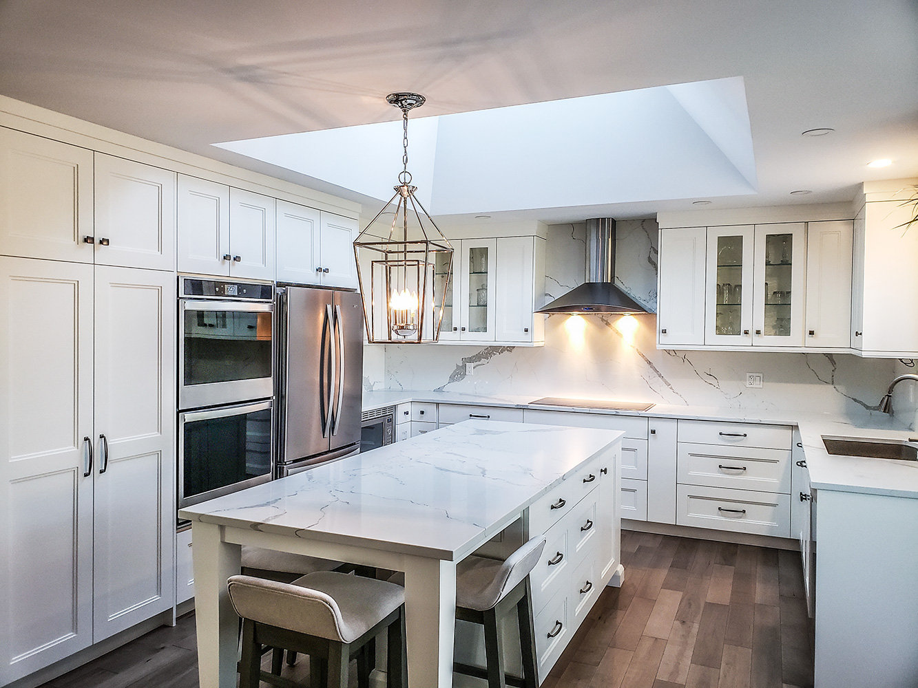 white custom kitchen with metal rangehood