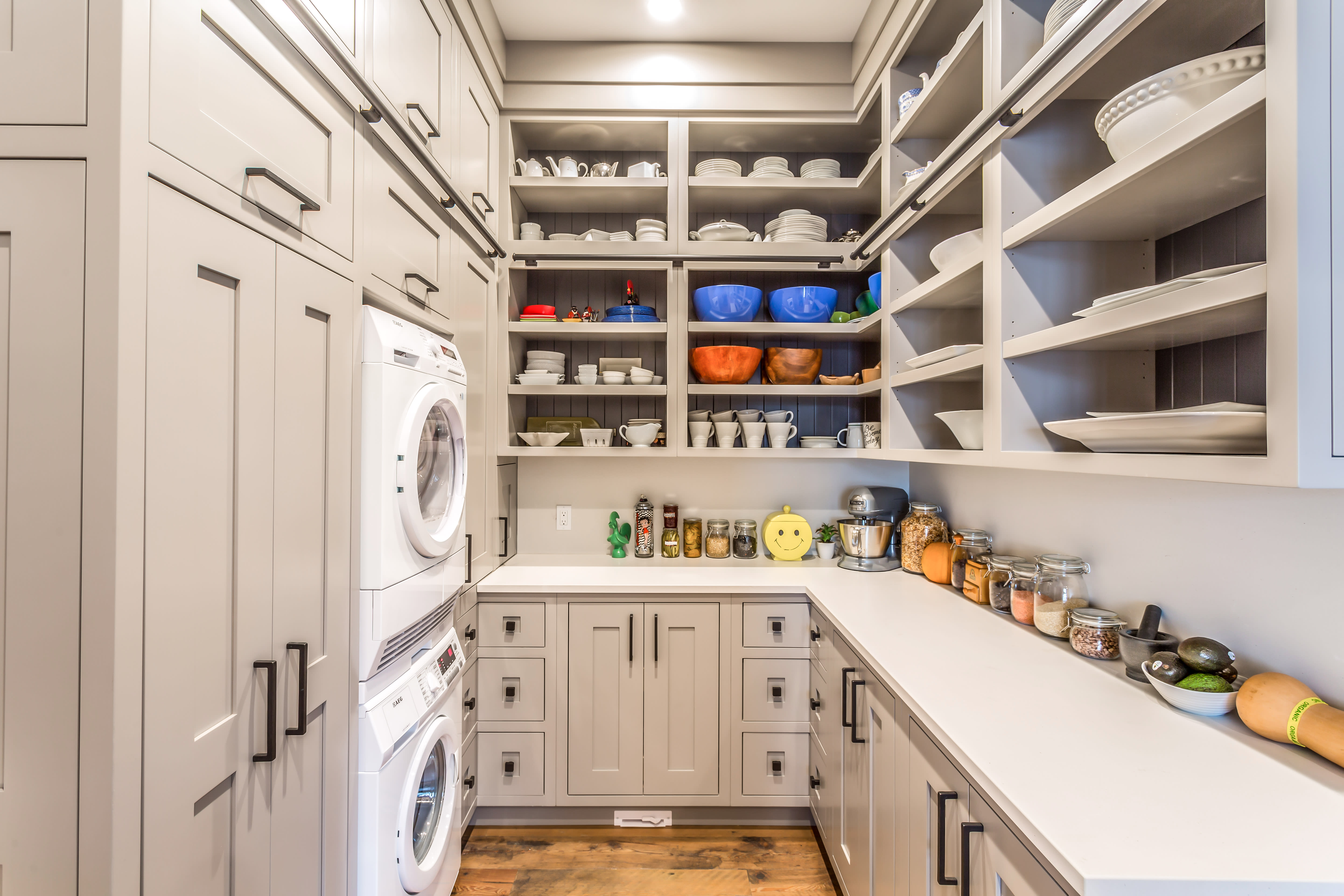 transitional taupe cottage pantry with open shelving and closed cabinets