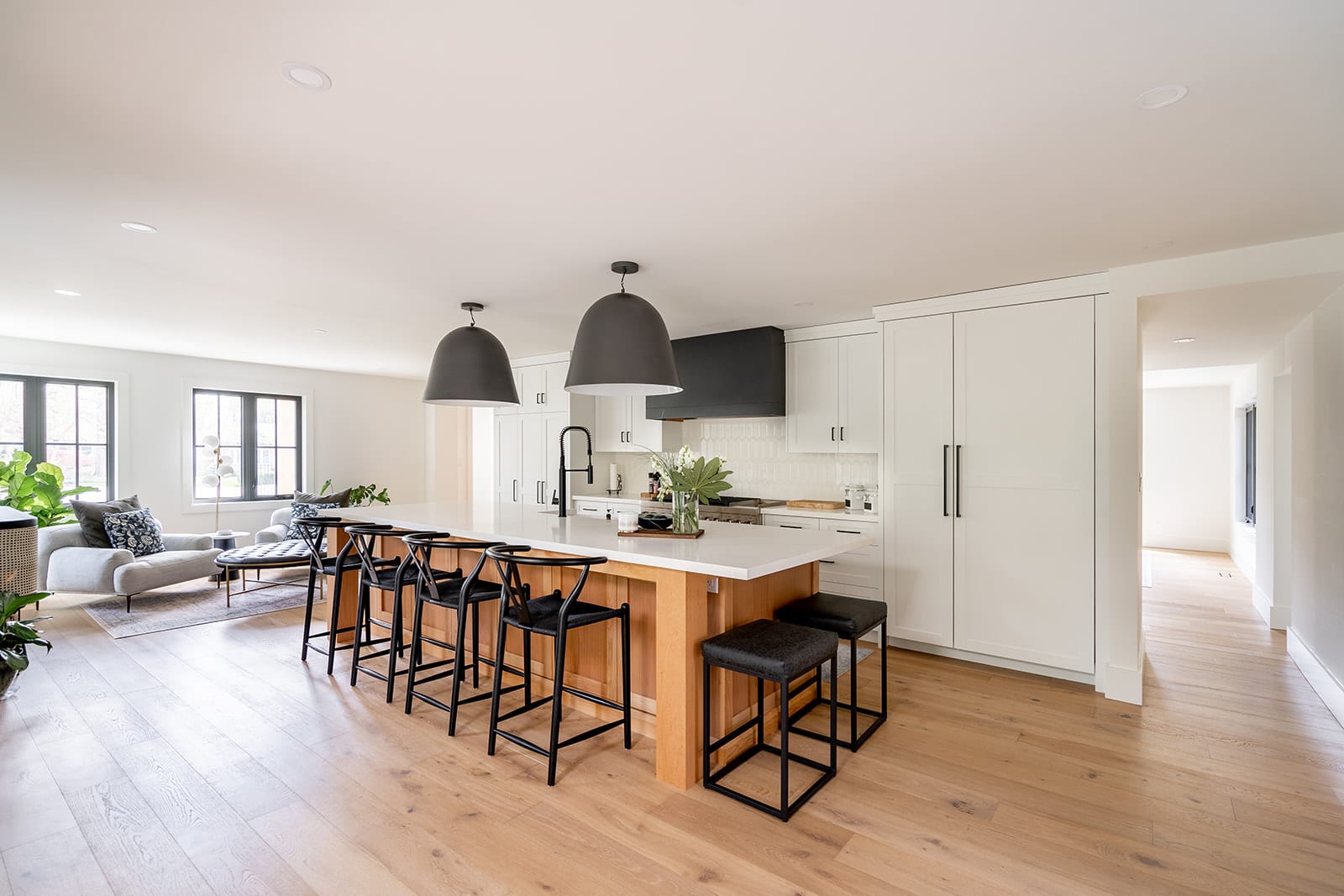 White and black farmhouse kitchen with alder wood island