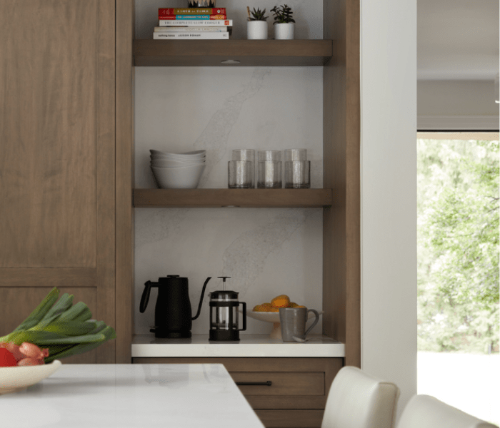 Stained Maple open shelving with quartz backsplash and black hardware