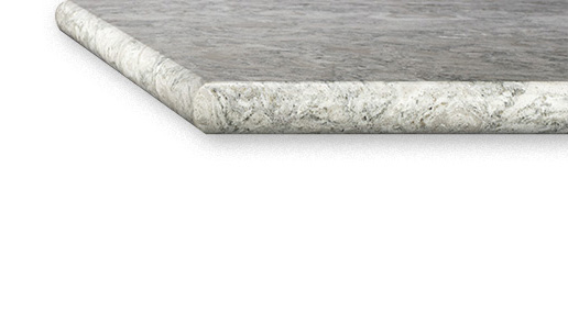 A bullnose countertop edge on a gray stone countertop with dark veining