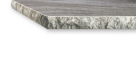 A chiseled edge countertop on a gray stone countertop