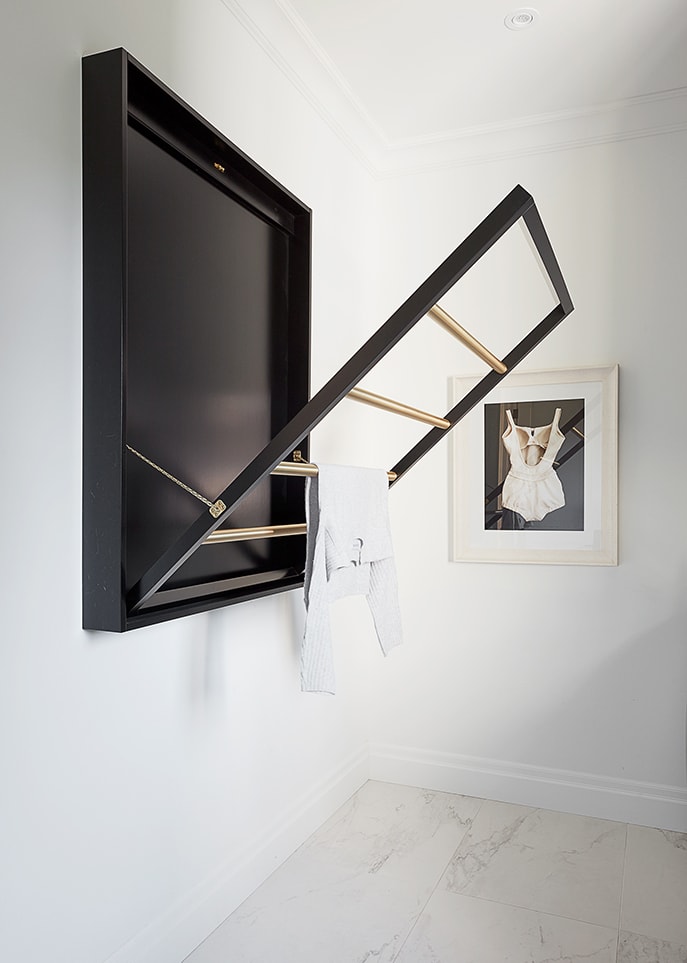 Drying rack on wall in laundry room 