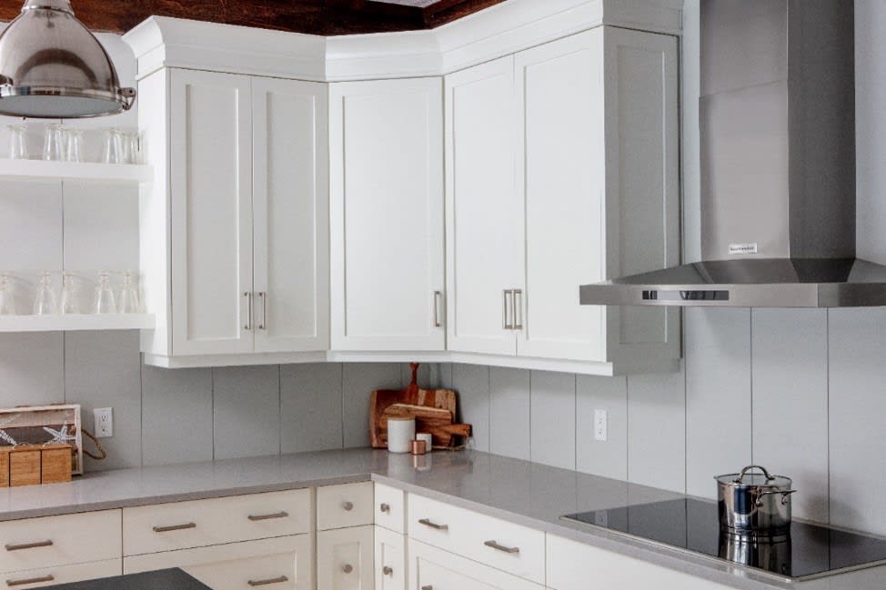 White kitchen with an angled corner cabinet