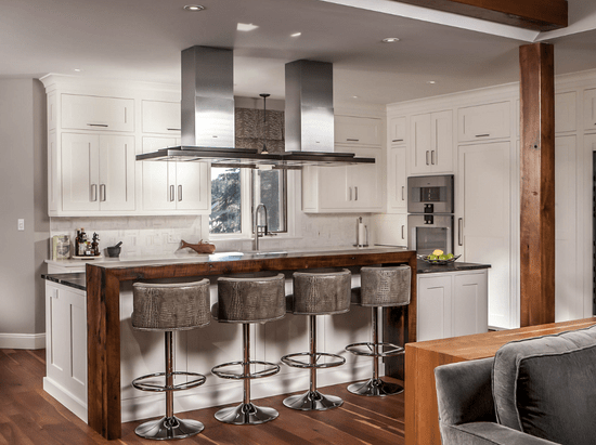 Custom kitchen island with bar-height seating in a transitional kitchen