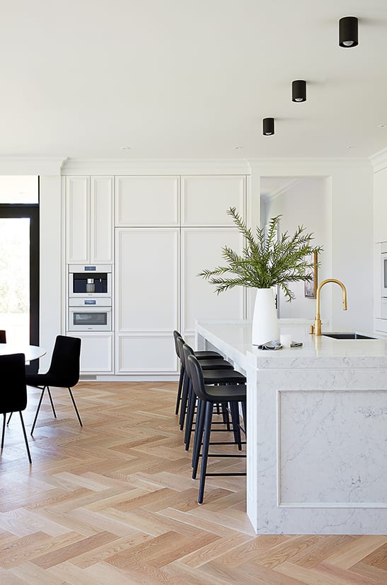 White panel cabinetry with hidden fridge 