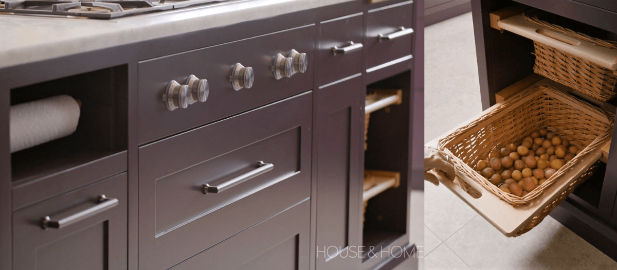 face frame purple kitchen cabinetry island with built in paper towel holder and rattan vegetable baskets 