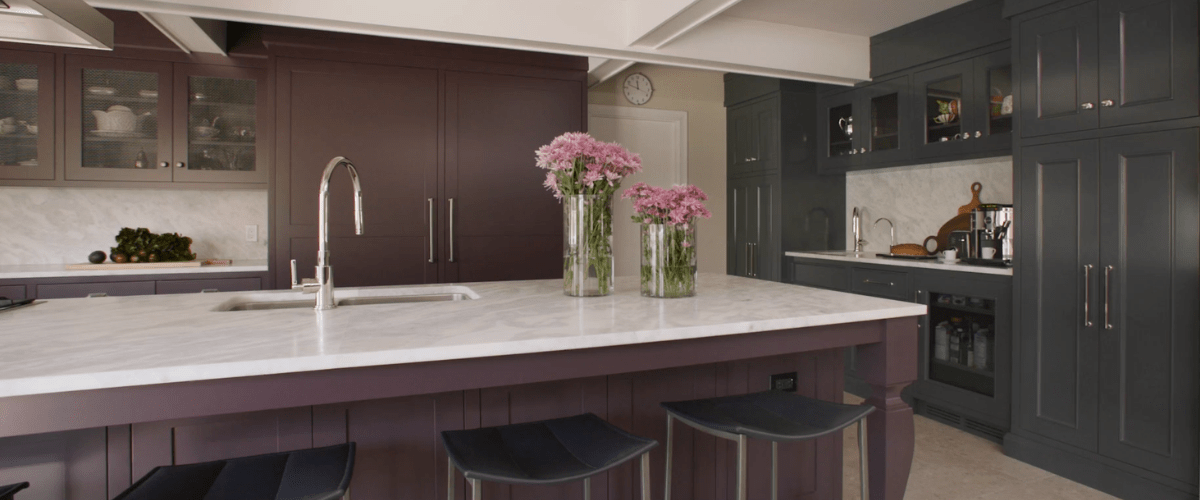 Face frame kitchen purple painted island cabinetry with grey-blue painted coffee bar and pantry 