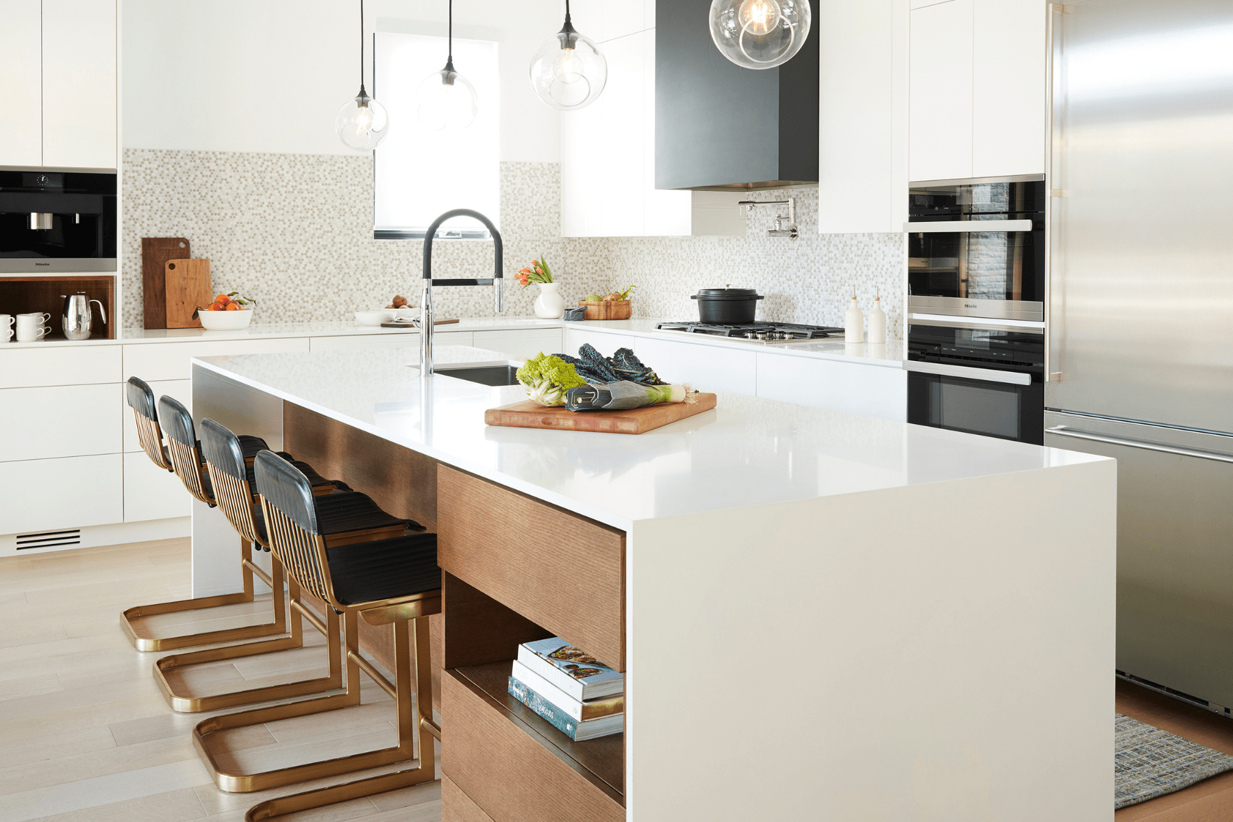 A white, black, and stained red oak custom kitchen. 