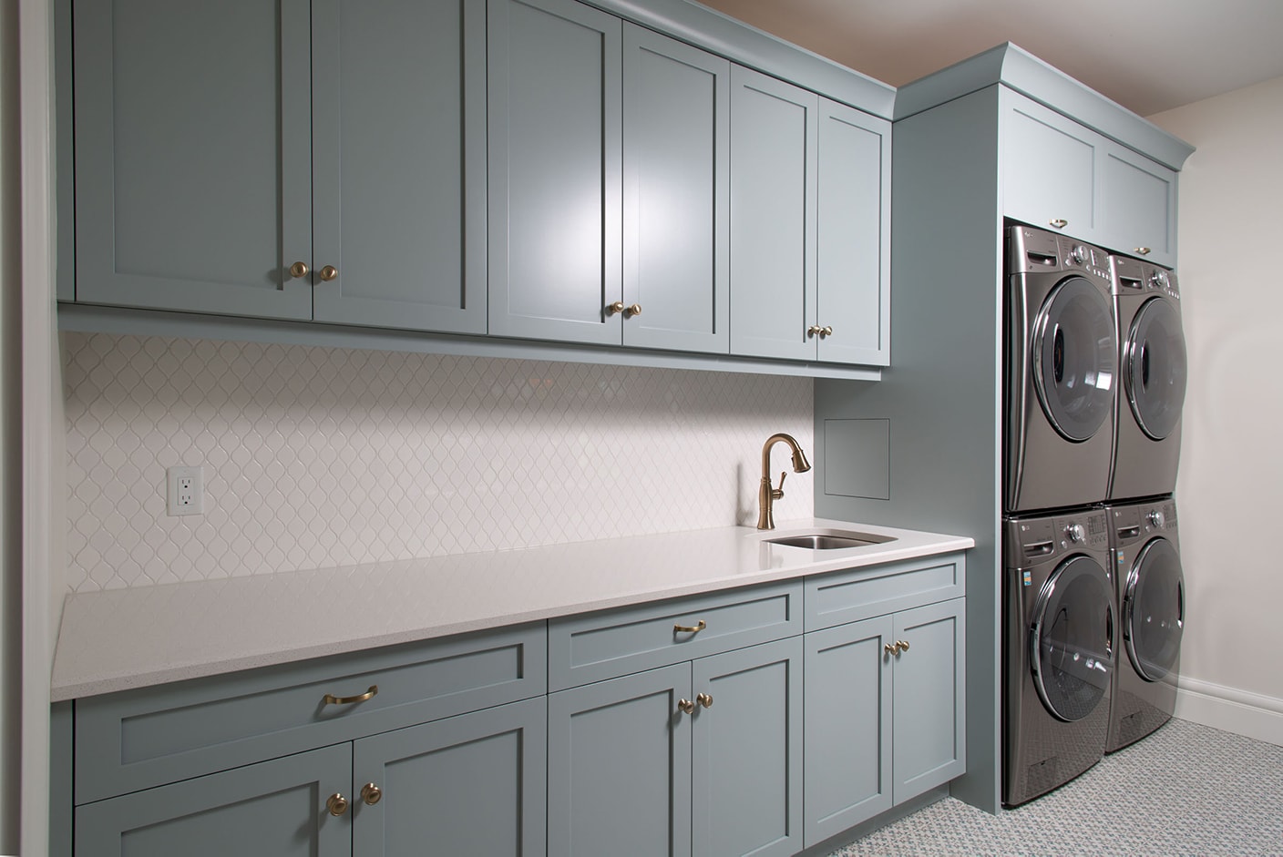 Blue custom cabinetry in a laundry room 