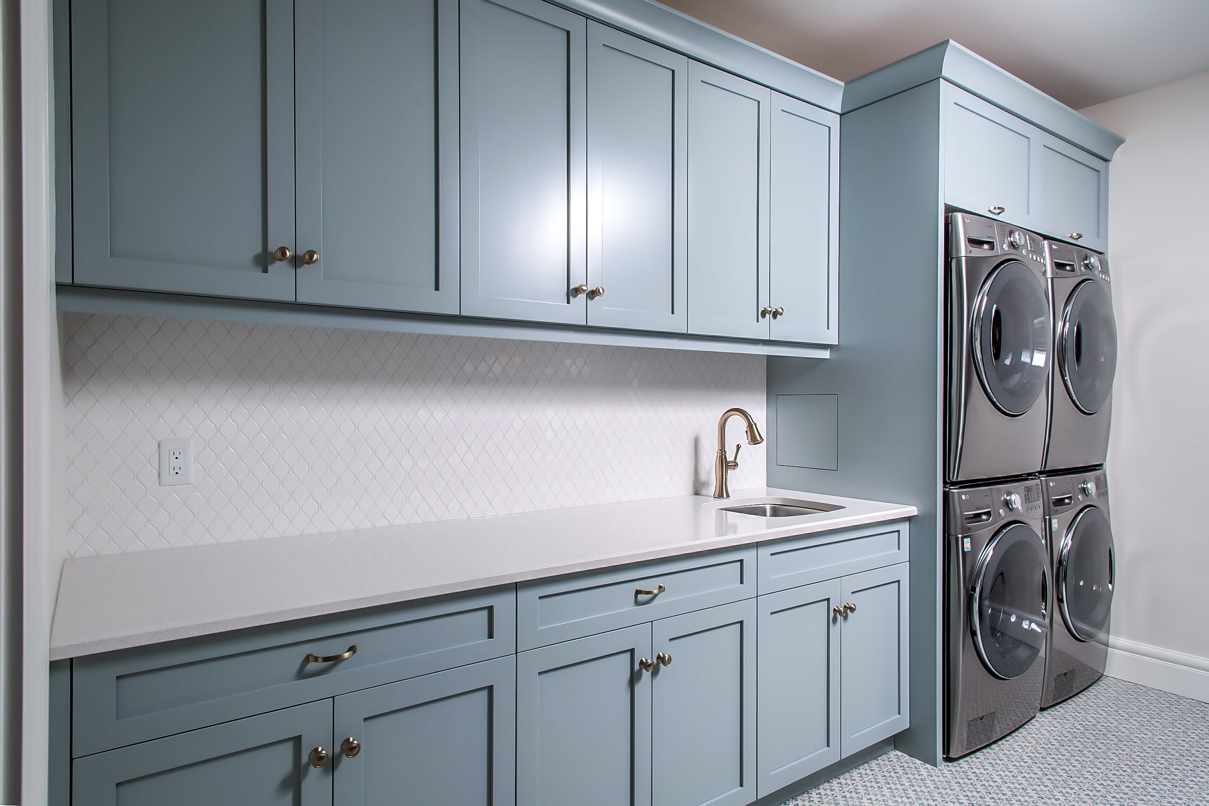 Luxury laundry room with stackable washer and dryer