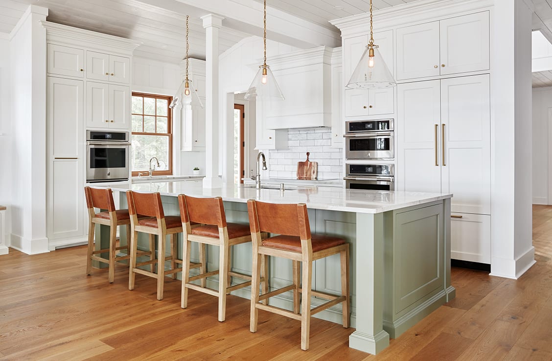 White kitchen with brass metal hardware 