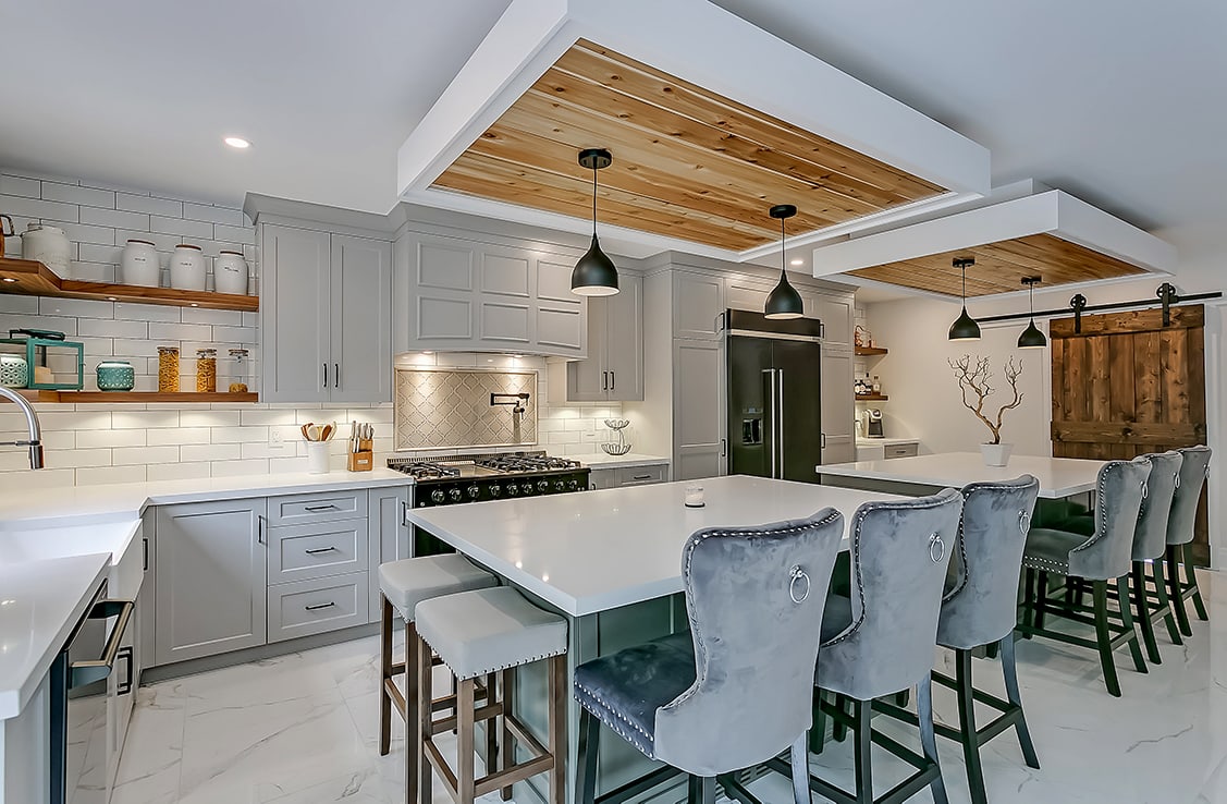 Grey cabinetry with barn board elements in a kitchen