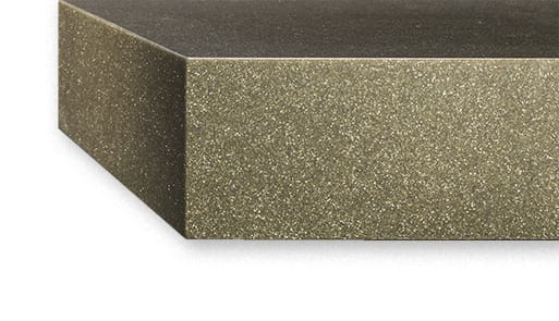 A mitered edge countertop on a brown-gold stone countertop