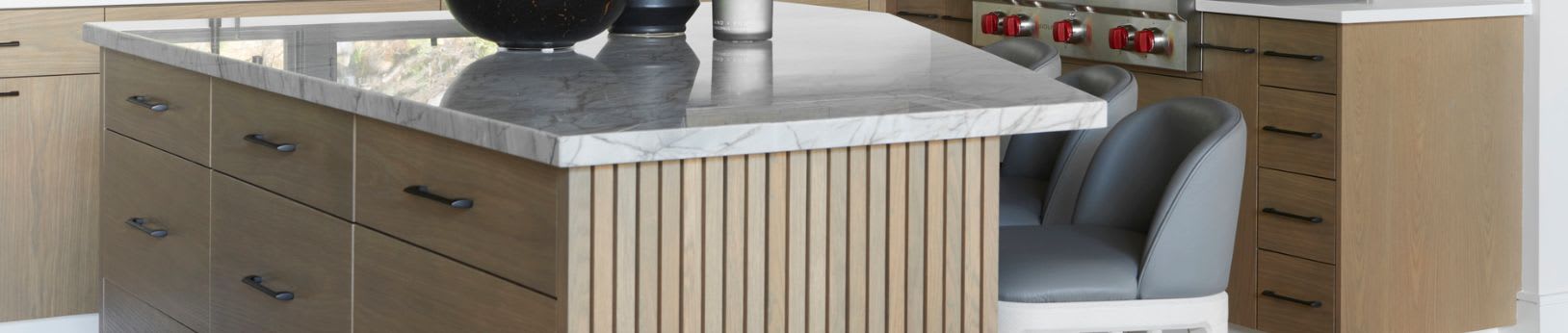 Modern kitchen with black painted cabinetry and natural rift oak accents 