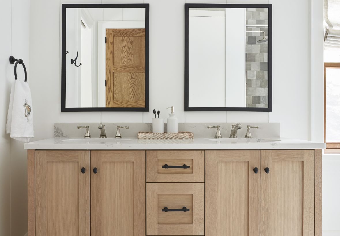double sink white oak bathroom vanity in muskoka cottage with black hardware and black mirrors