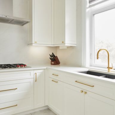 White modern kitchen with cabinets and countertop