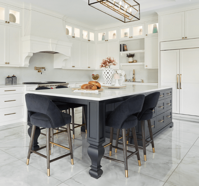 White cabinets with dark island kitchen design