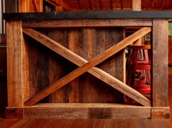 X design on end of custom kitchen island in rustic cottage