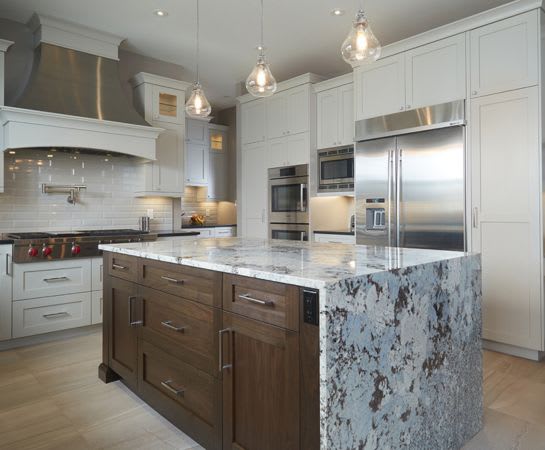 Bright open concept kitchen with natural stone granite kitchen countertops