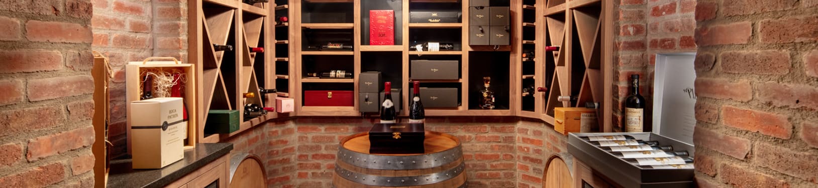 Wine cellar with exposed brick walls, custom wine shelves, and barrels