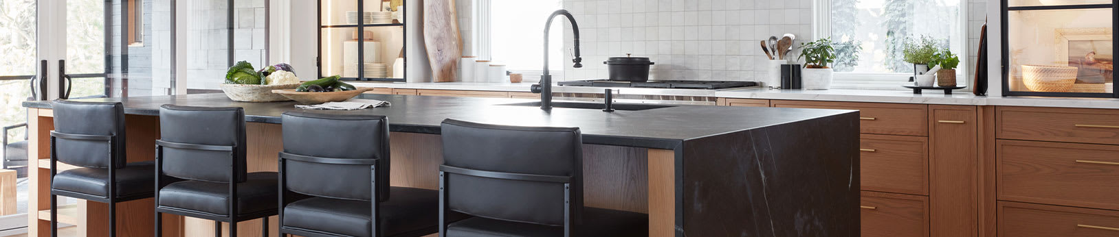 modern black and white rift oak kitchen with waterfall countertop