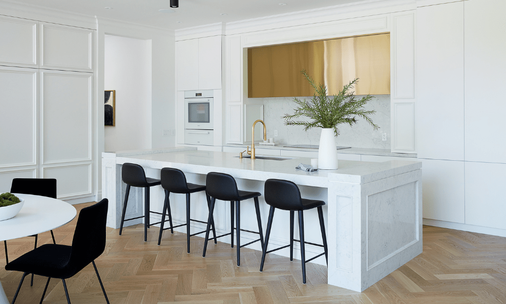 white custom kitchen with metal gold range hood