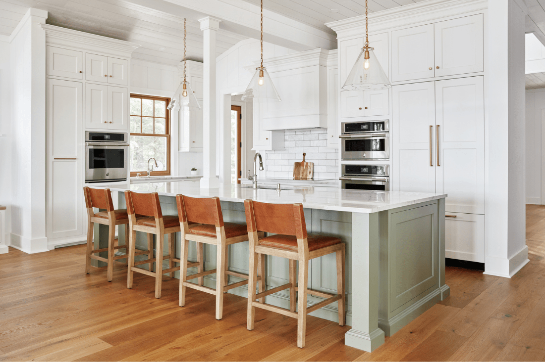 modern white kitchen with custom green kitchen island and kitchen island posts