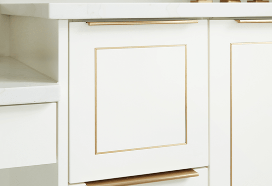 white custom cabinetry with gold metal inlay