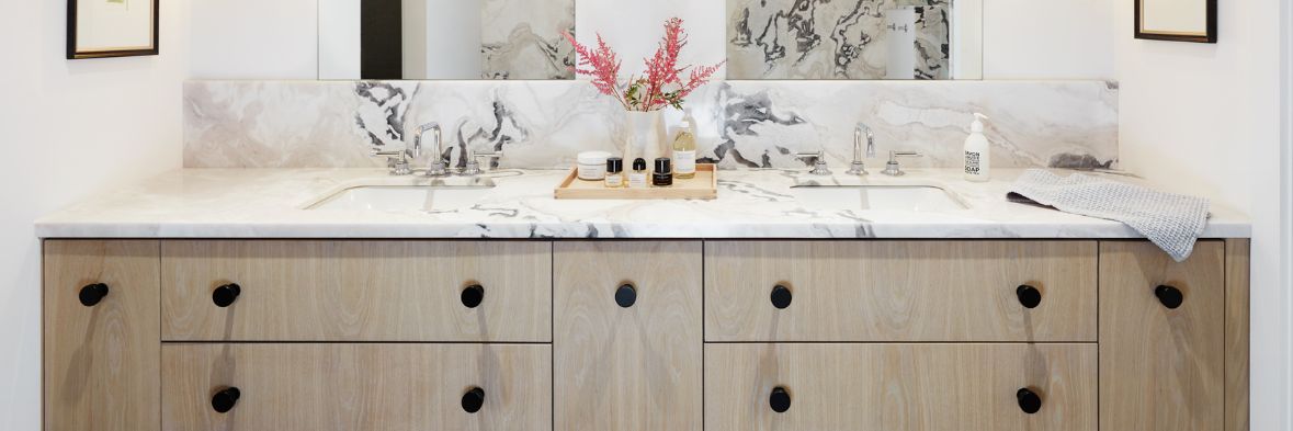 Close up shot of black and white Quartz countertop on white oak vanity